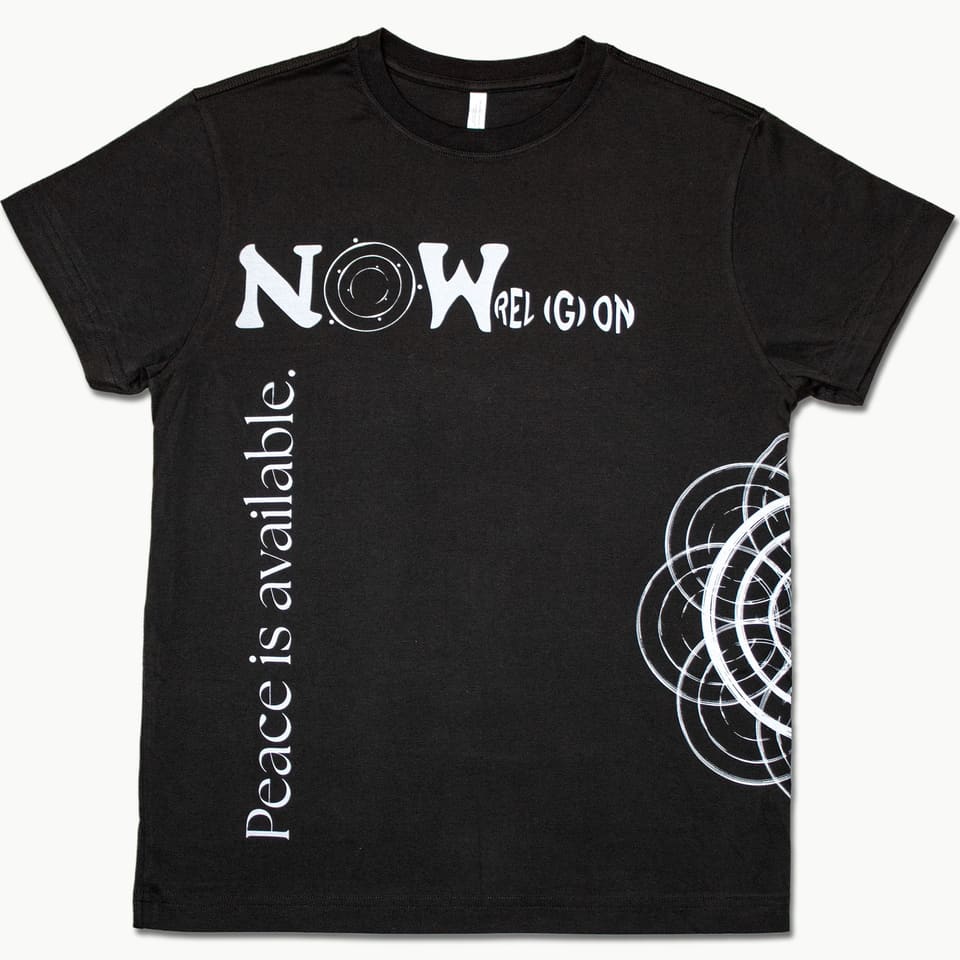 Front of a black tee with 'NOW rel(g)ion' across the chest, 'Peace is available.' running vertically and arcs at the right hem.
